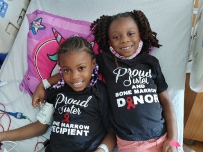 Kennedi and her sister and bone marrow donor, Hayli