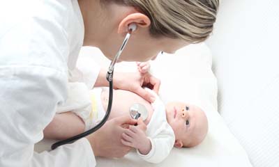 Doctor examining baby