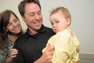 Thomas Summers with his parents.